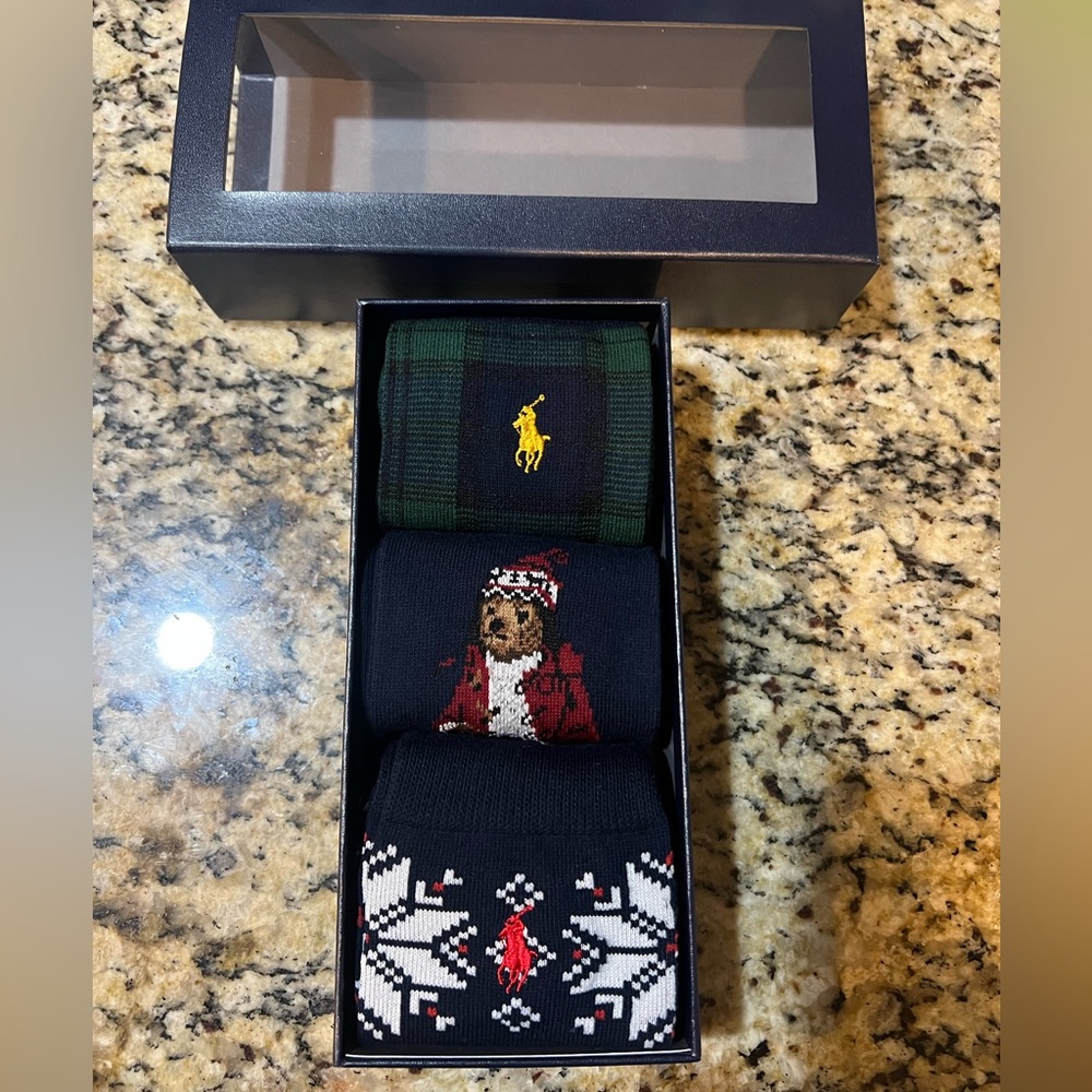 Box of 3 pair of polo Ralph Lauren dress socks.
Mostly navy with a mix of red.